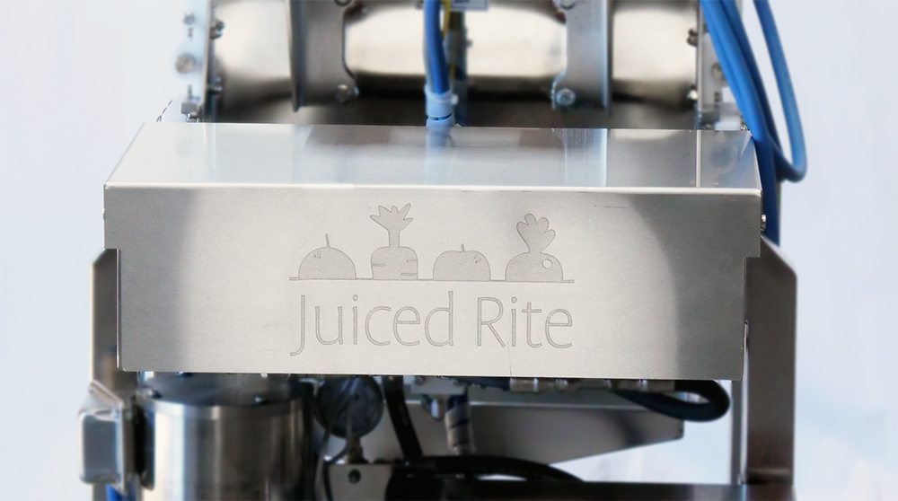 Back Panel on a Juiced Rite Machine with the logo etched into the flat silver pane.