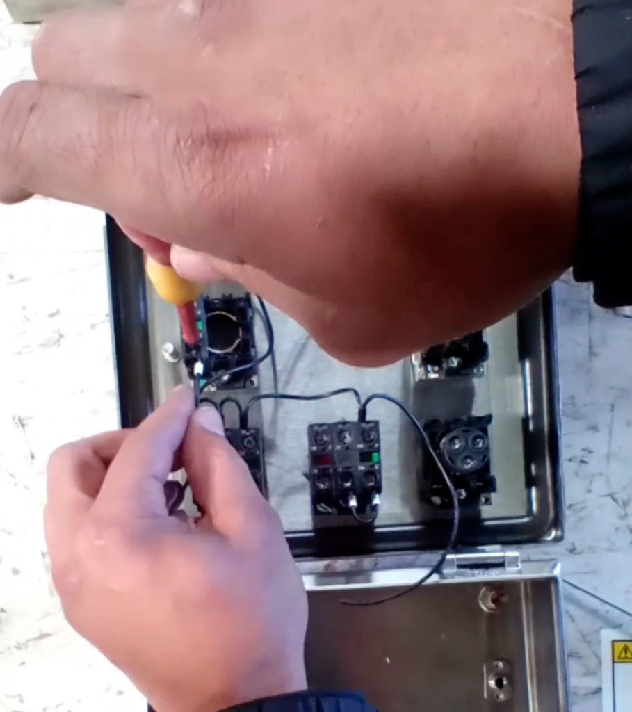 Demonstration of Tightening the Screws in Number Three Terminal