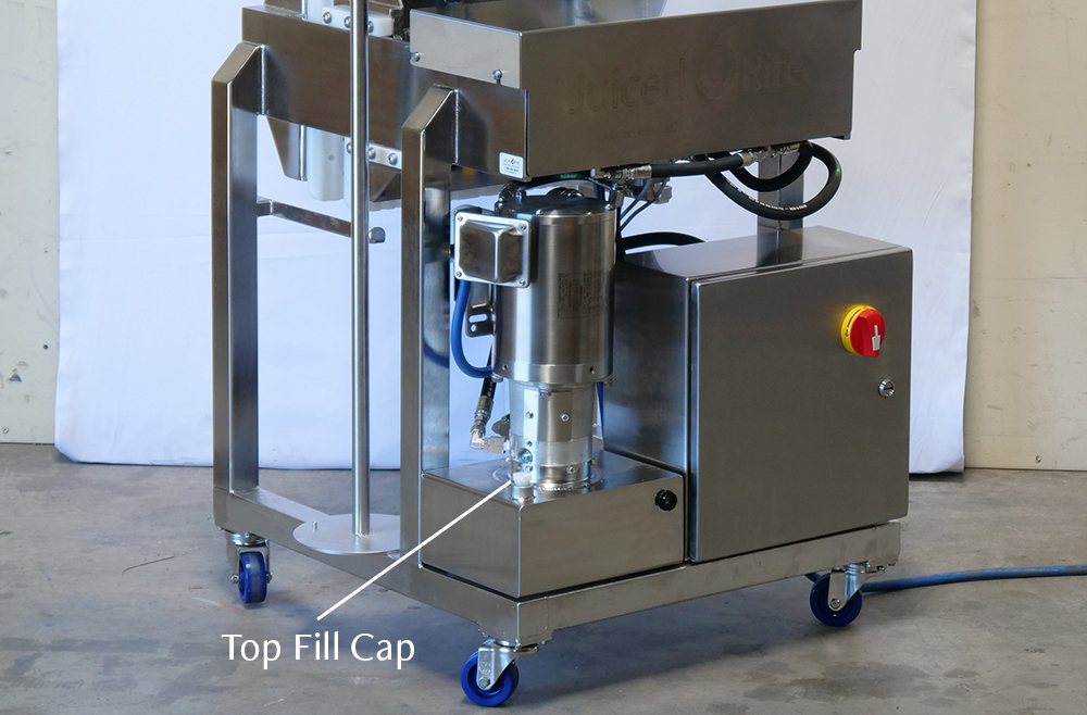 Photo of a Juiced Rite M100 Cold Press Machine. There is a label on the image pointing to the Top Fill Cap.